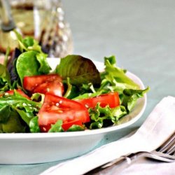 A Salad of Arugula (Rocket), Cherry Tomatoes and Sesame Seed recipe