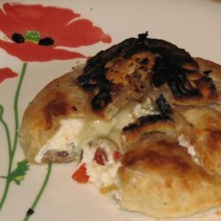 Brie En Croute Stuffed With Olives & Roasted Peppers recipe