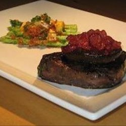 Marinated Steaks With Asparagus Topped With Garlic Breadcrumbs A recipe