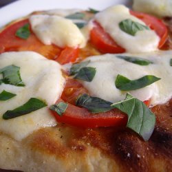 Grilled Flatbread with Ricotta Cheese, Fresh Tomatoes, Oregano and Roasted Garlic Oil (Bobby Flay) recipe