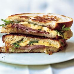 Grilled Ham and Gouda Sandwiches with Frisée and Caramelized Onions recipe