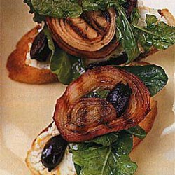 Grilled Bread Topped with Arugula, Goat Cheese, Olives and Onions recipe
