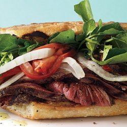 Grilled Steak Sandwiches with Marinated Watercress, Onion, and Tomato Salad recipe