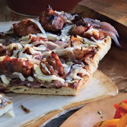 Grilled Flatbreads with Caramelized Onions, Sausage, and Manchego Cheese recipe