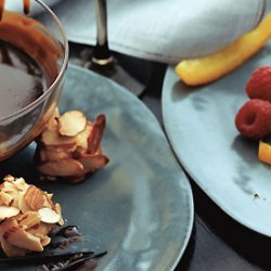 Chocolate Fondue with Candied Orange Peel, Raspberries, and Almond Macaroons recipe