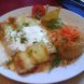 chicken enchilada and mexican style rice with monterey jack cheese sauce