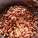 beans, pinto, mature seeds, sprouted, cooked, boiled, drained, with salt