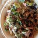 Chipotles burrito bowl shredded beef, black beans, brown rice, veggies, tomatoe salsa, corn salsa, cheese, lettuce Calories