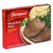 sliced beef meal with gravy mashed potatoes and peas in seasoned sauce