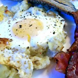 Baked Eggs on a Bed of Potatoes With Bacon
