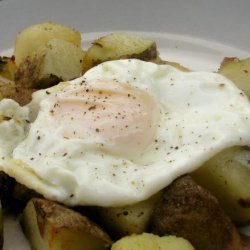 Potato and onion hash with a fried egg (for one)