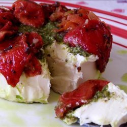 Brie Topped With Pesto and Sun-Dried Tomatoes