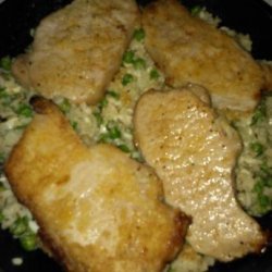 Pork Chops over Parmesan Rice With Peas