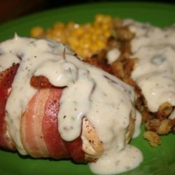 Stuffed Chicken Wrapped in Bacon Served With Gravy