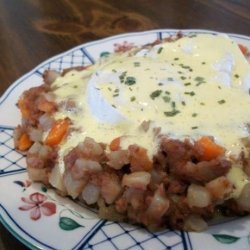Corned Beef Hash With Poached Eggs Under Hollandaise