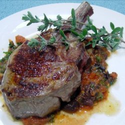 Veal cutlets with olive, tomato and anchovy sauce