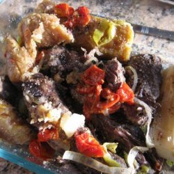 Baho (Beef, Plantains and Yuca Steamed in Banana Leaves)