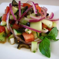 Cucumber Tomato Salad With Zucchini and Black Olives and a Lemon