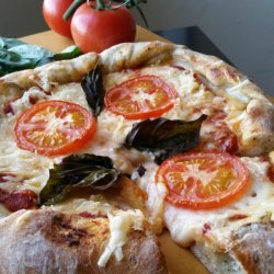 Pizza With Tomatoes, Mozzarella and Basil