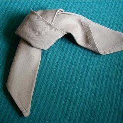 Serviette/Napkin Folding, Tied in a Loose Knot.