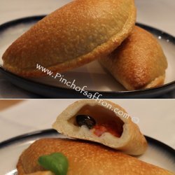 Calzoni Filled With Mozzarella, Black Olives, Toma...