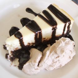 White Chocolate Cheesecake with White Chocolate Brandy Sauce
