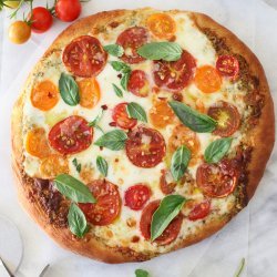 Pizza with Pesto, Fresh Tomatoes, and Mozzarella